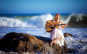 woman-playing-guitar-coast